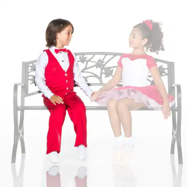 Young boy and girl in formal attire holding hands