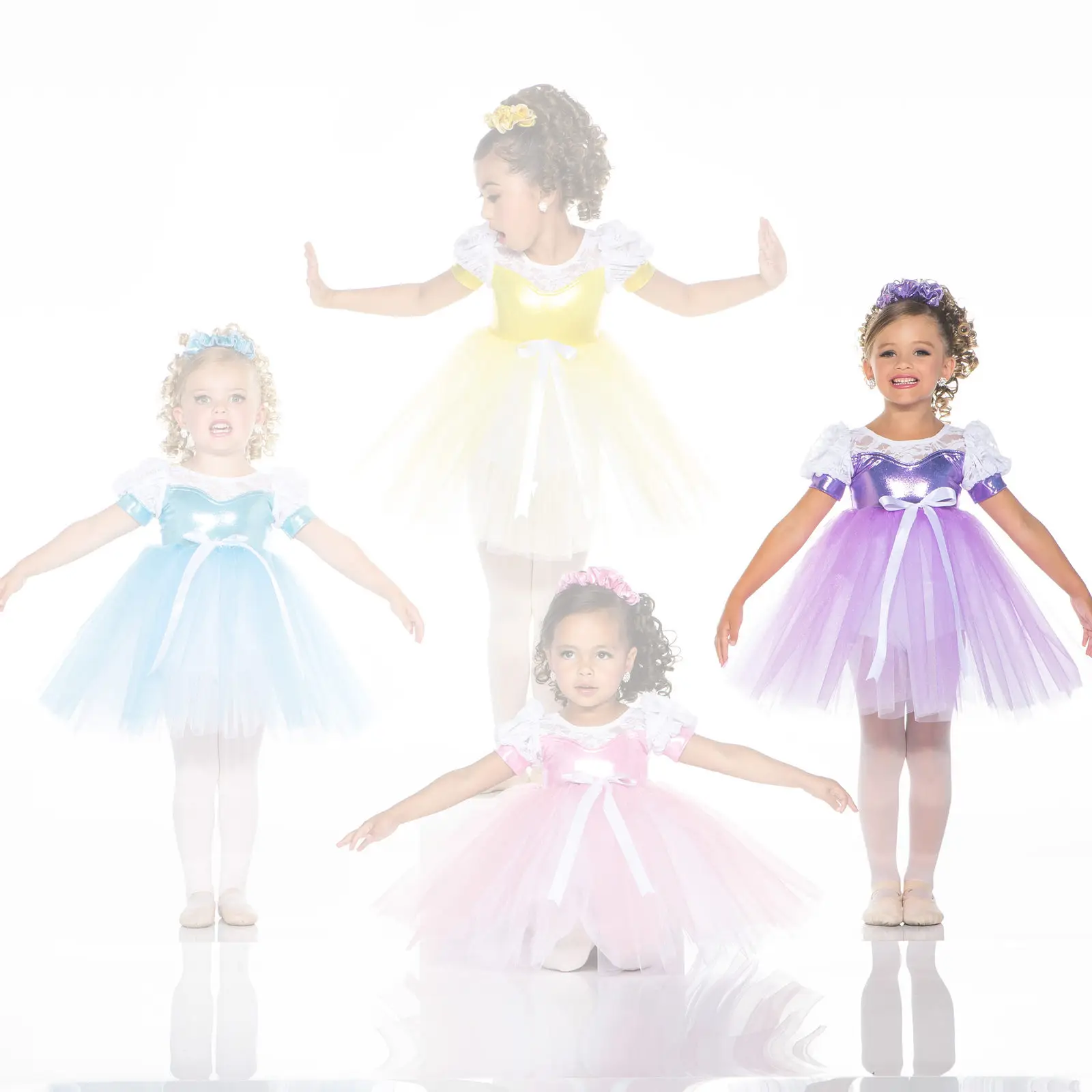 Four young girls in colorful princess ballet dresses