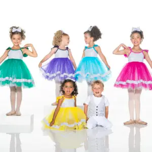 Children modeling colorful dance costumes against a white studio background