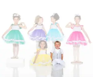 Children modeling colorful tutu dresses and a patterned vest