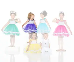 Children modeling colorful tulle dresses and a matching vest