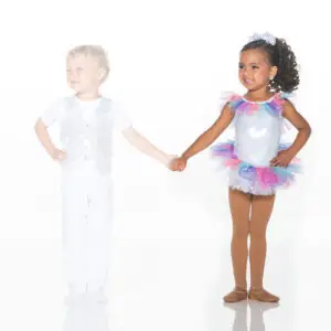 Children holding hands in glittery dance costumes