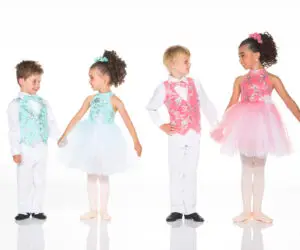 Four children in colorful formal dance costumes on white background