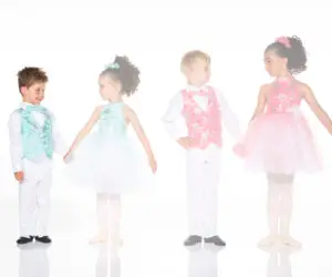 Four children wearing colorful formal dance costumes