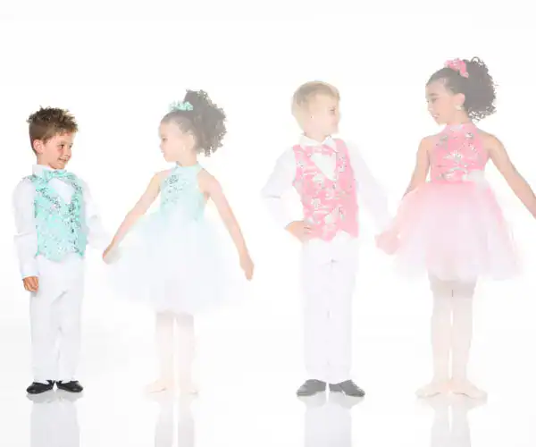 Four children wearing colorful formal dance costumes