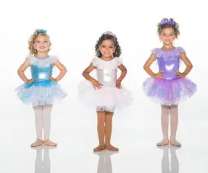Three young girls wearing colorful sparkly ballet costumes
