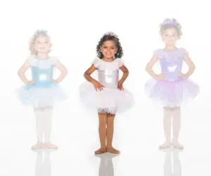 Three young ballerinas wearing pastel sparkly tutus