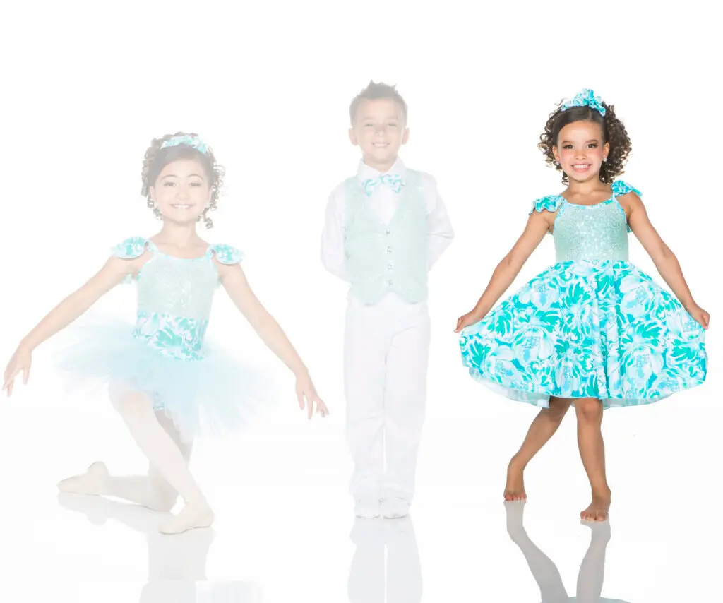 Three children modeling turquoise floral dance costumes