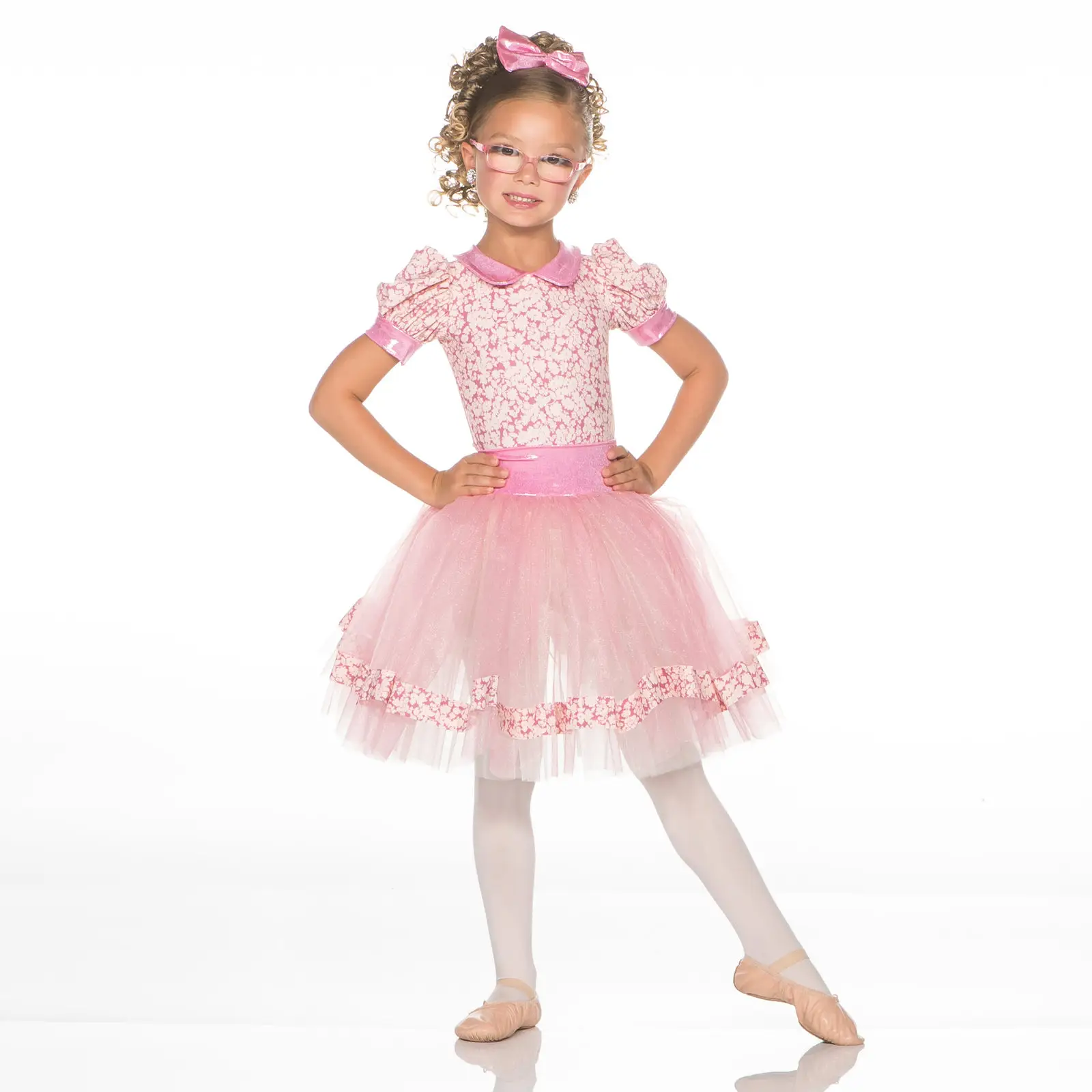 Girl wearing pink floral ballet costume and glasses