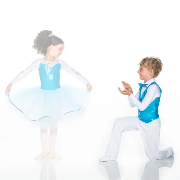 Young ballet dancers in matching blue costumes posing together