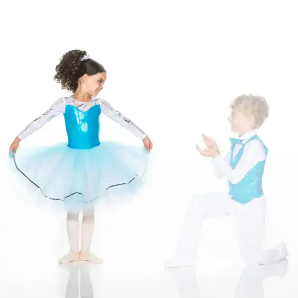 Young dancers in turquoise costumes performing ballet pose