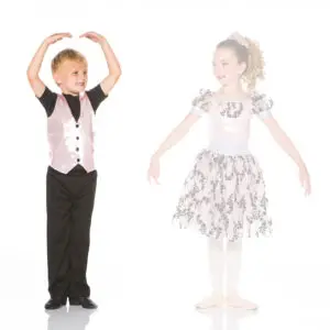Young boy and girl in dance costumes posing together