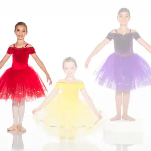 Three young ballerinas wearing red, yellow, and purple tutus
