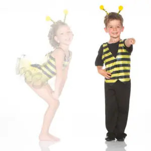 Children wearing bee costumes on a white background