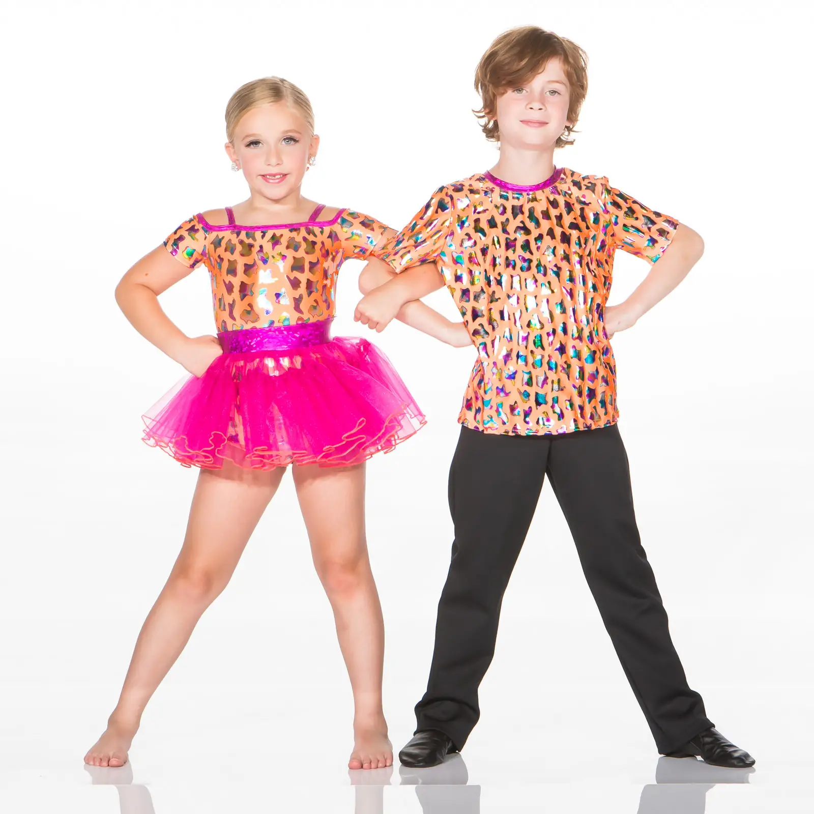 Two children pose in matching leopard-print dance costumes.