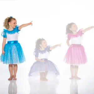 Three girls in colorful dance costumes pointing right
