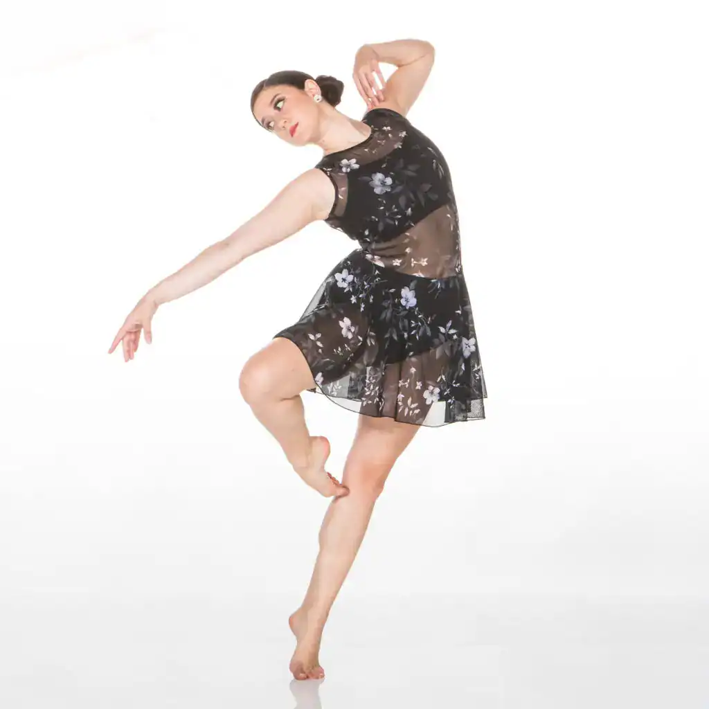 Ballet dancer in a black floral dress posing