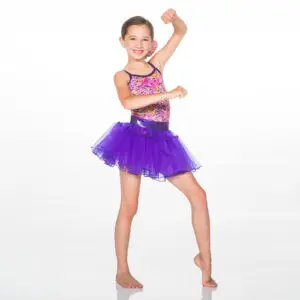 Smiling young dancer in colorful leotard and purple tutu