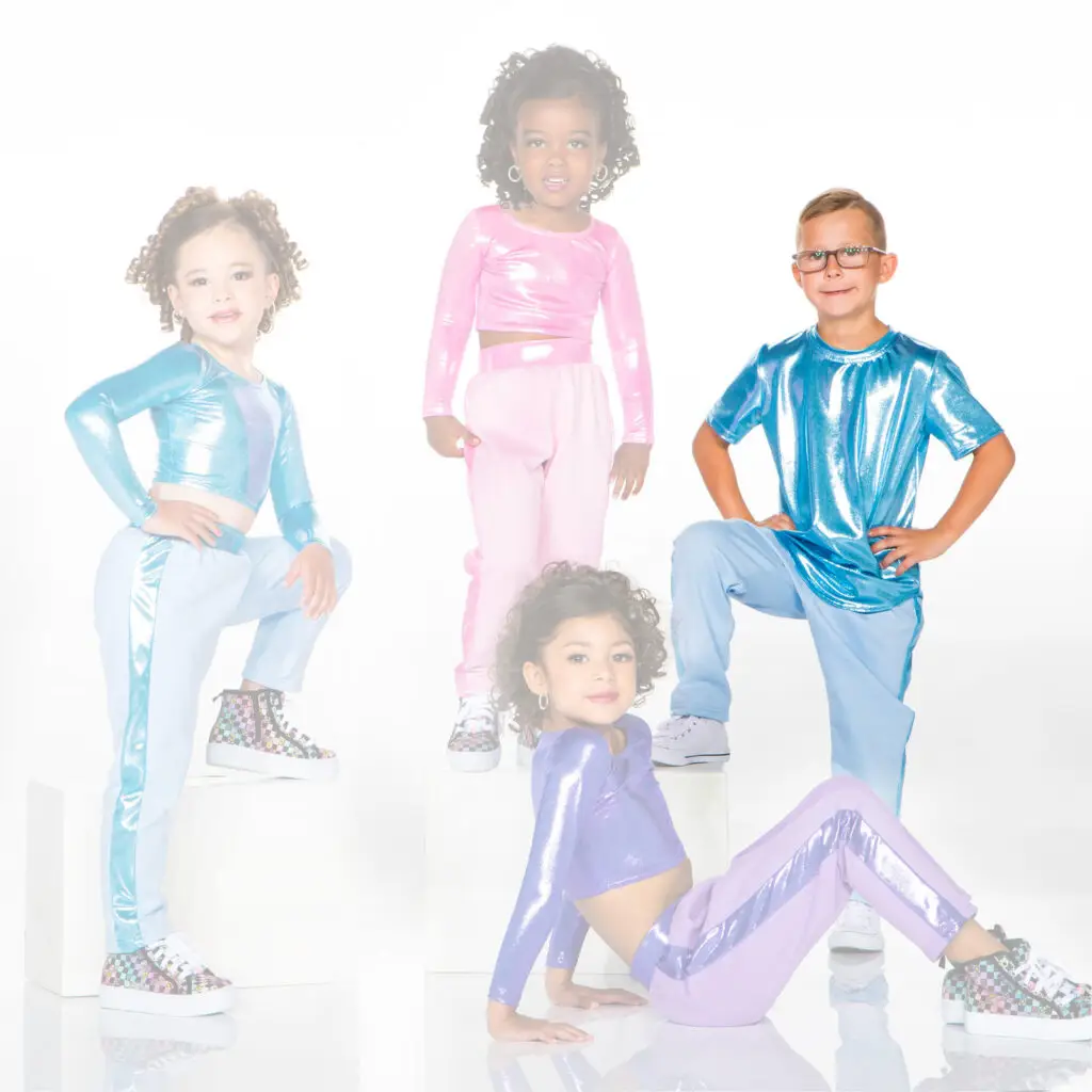 Four children pose in colorful metallic dance outfits.