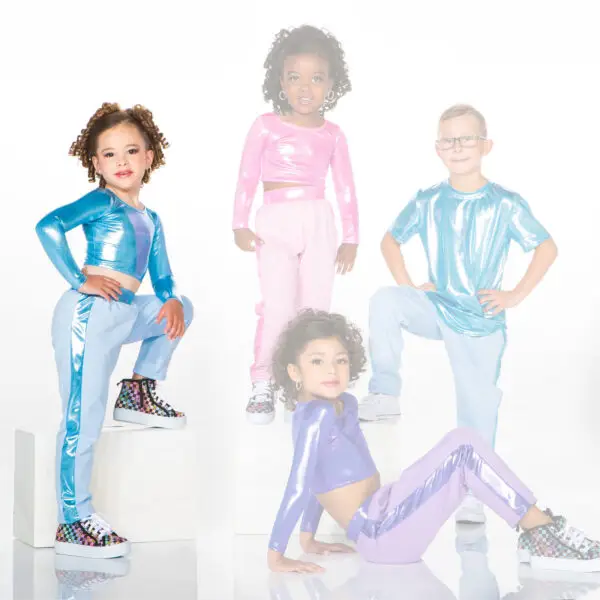 Four children pose in colorful metallic dance outfits.