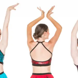 Three dancers model colorful tiger-print performance tops.