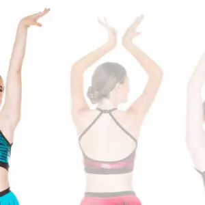 Three dancers modeling colorful sparkly crop tops with raised arms