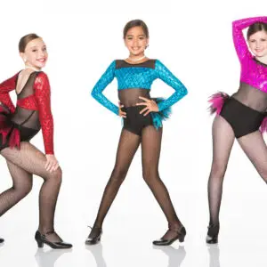 Three young dancers wearing colorful sequined costumes and fishnet tights