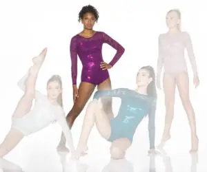 Dancers posing in colorful lace leotards against white background.
