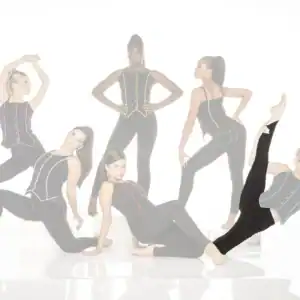 Six women pose in black dancewear with colorful trim.