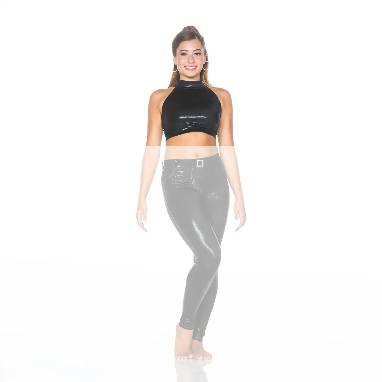Smiling woman wearing black crop top and shiny leggings