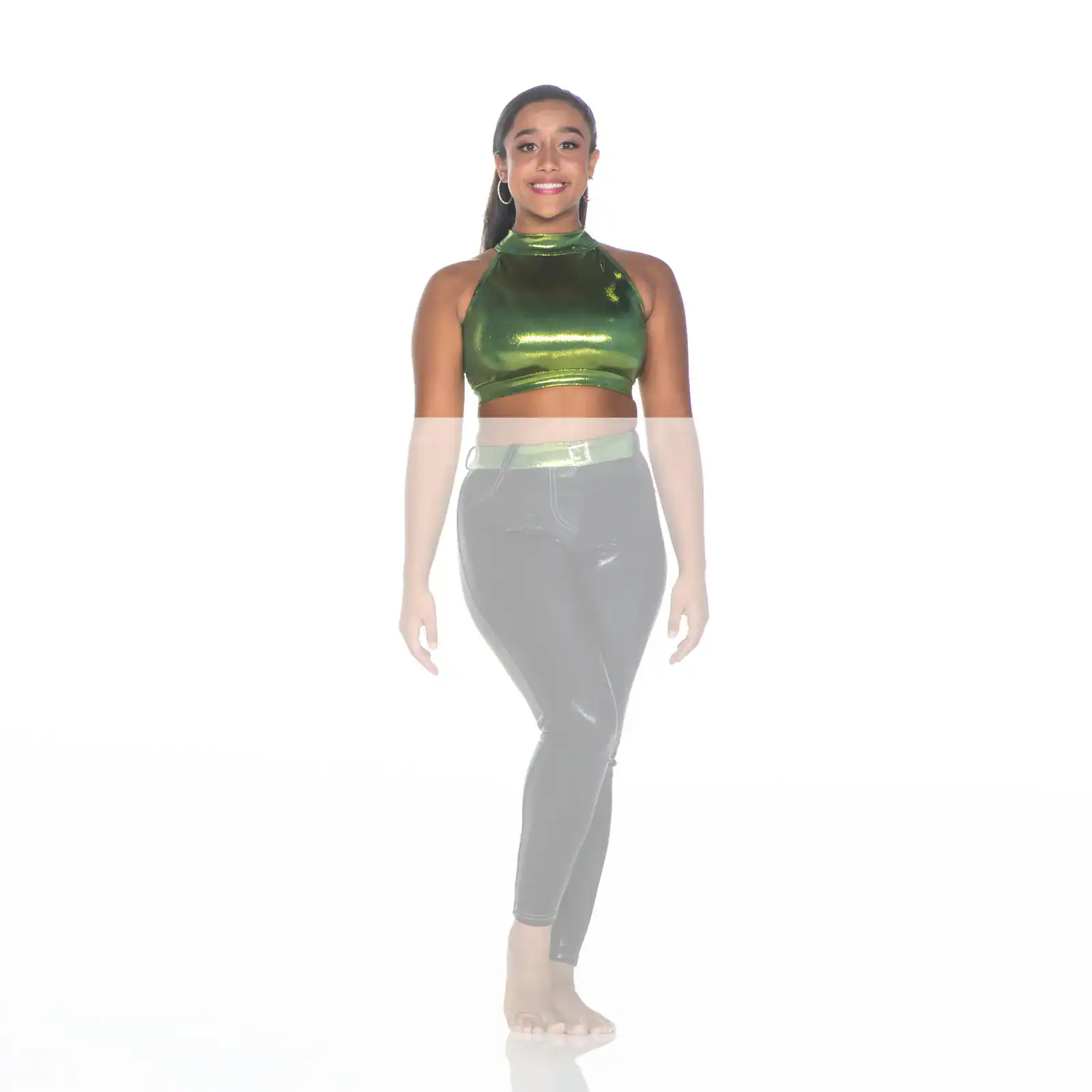 Woman wearing a green metallic crop top and black leggings