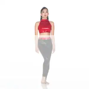 Model wearing red halter crop top and black pants