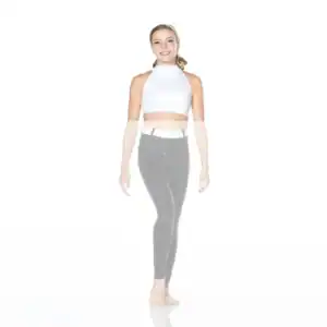 Smiling woman in white crop top and black leggings