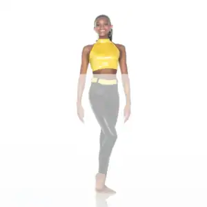 Smiling woman in yellow crop top and black leggings