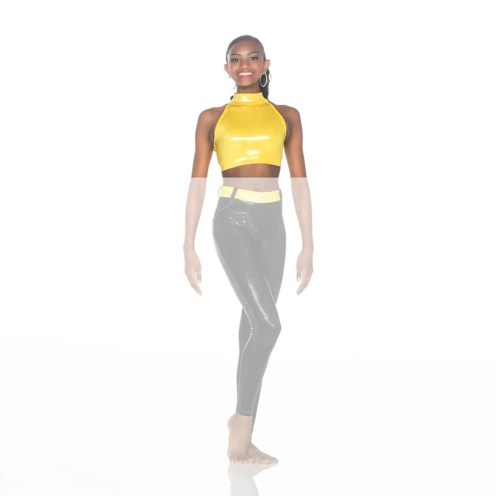 Smiling woman in yellow crop top and black leggings