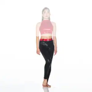 Model wearing pink crop top and black vinyl pants