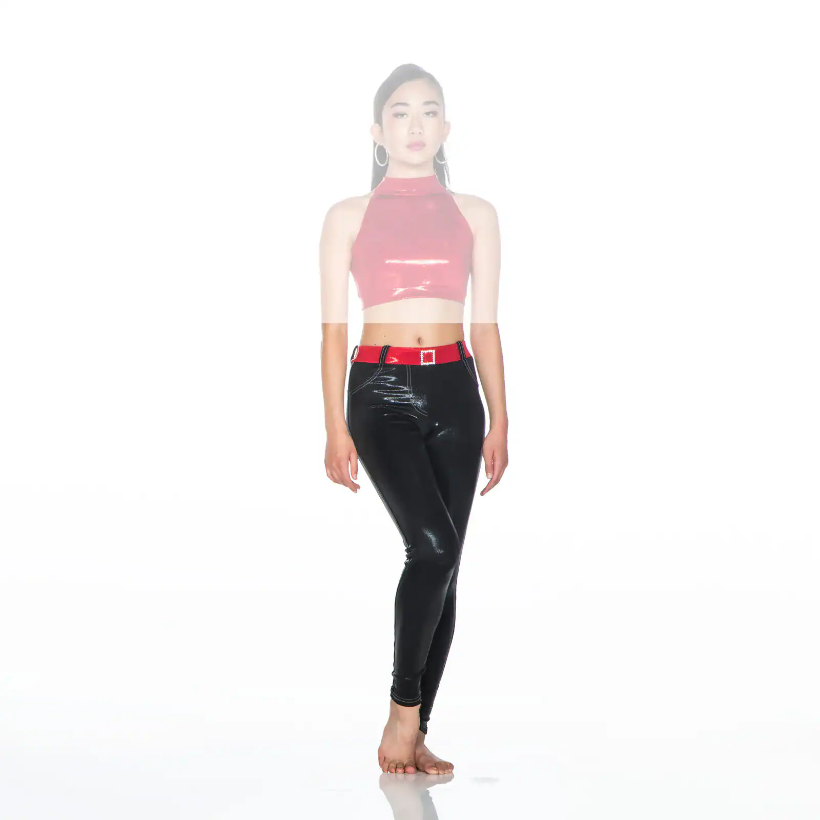Model wearing pink crop top and black vinyl pants