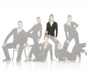 Six models wearing black suits with colorful piping