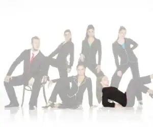 Six models wearing black suits with colorful piping