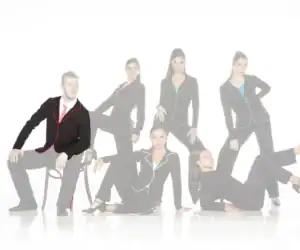 Six models wearing black suits with colorful piping