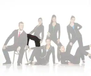 Six models pose in black suits with colorful piping.