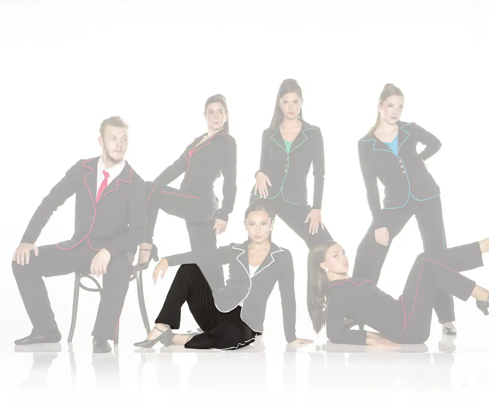 Six models wearing black suits with colorful piping.