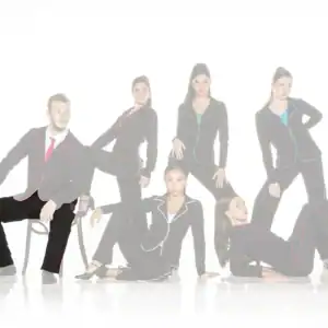 Six models pose in black suits with colorful piping.