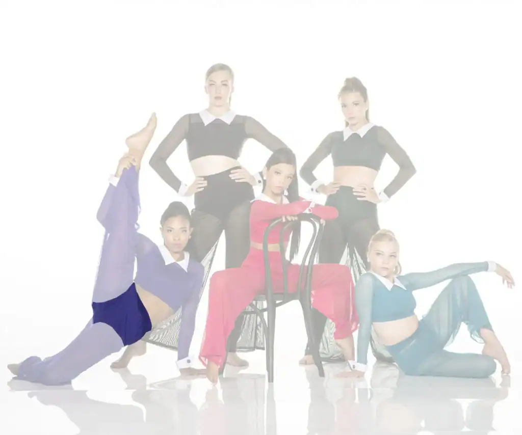 Five dancers pose in colorful costumes around a chair.
