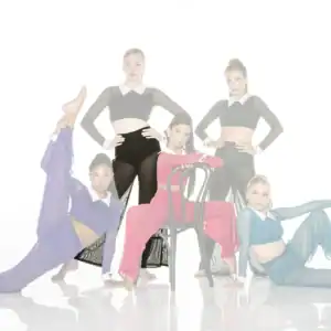 Five dancers pose in colorful costumes against a white background.