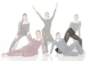 Five female dancers posing in sheer black costumes