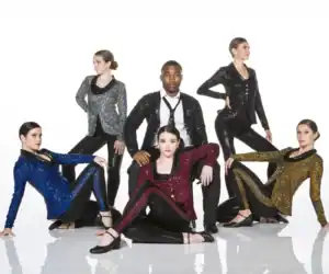 Five dancers pose in colorful sequined jackets and black attire.