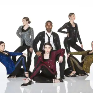 Five dancers pose in colorful sequined jackets and black attire.