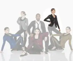Six performers pose in sparkling jackets against a white background.