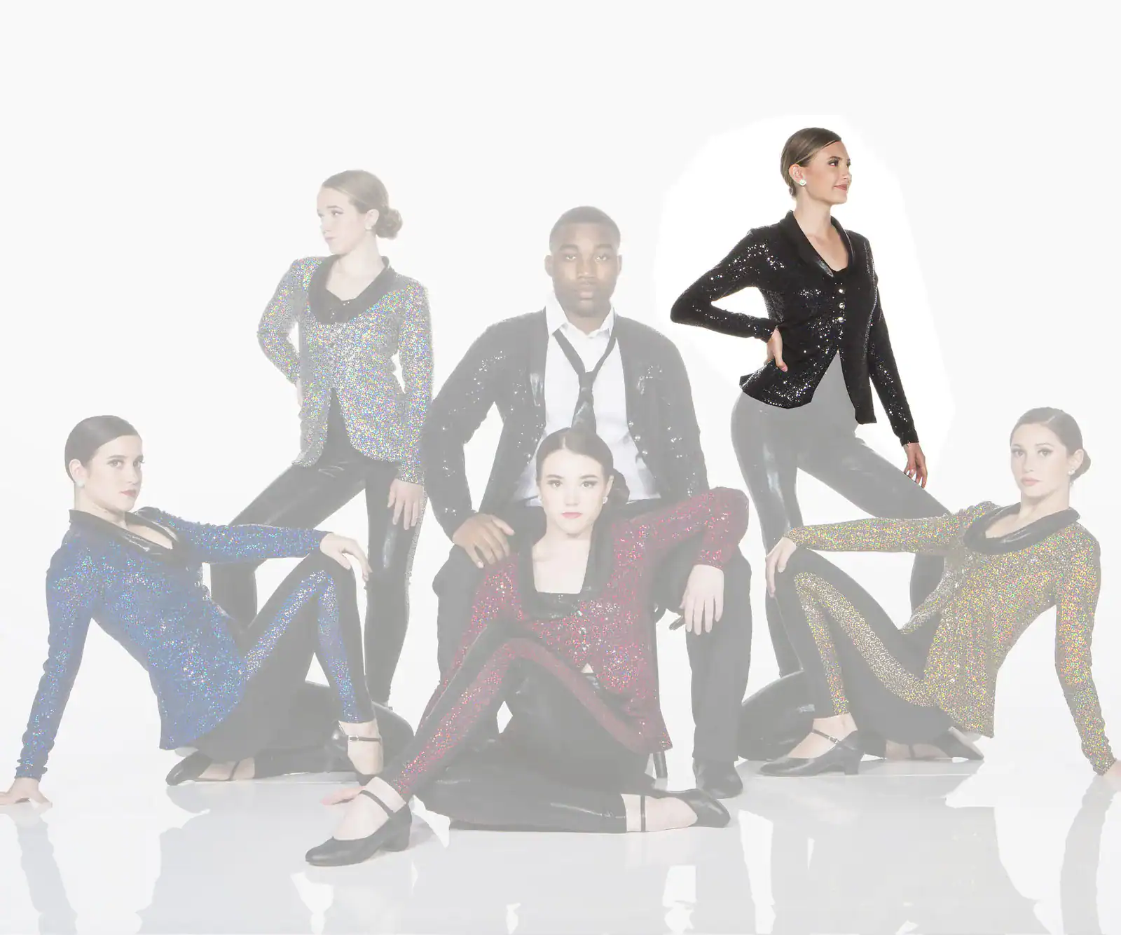 Six performers pose in sparkling jackets against a white background.